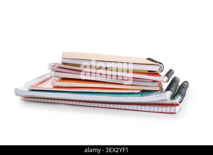 Stack of many different notebooks isolated on white background Stock Photo