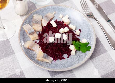 Beetroot served with cheese and pickled mackerel Stock Photo
