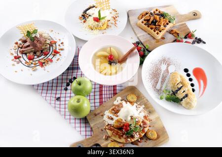Assorted Desserts and Sweet Dishes Served on Table Top View Stock Photo