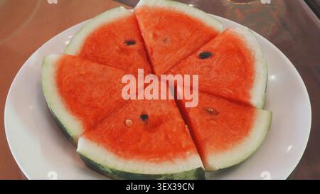 Top Down Close Up Fresh Sliced Red Watermelon On Round White Ceramic Plate Summer Fruit Stock Photo