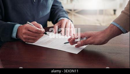 Hands, person and reading documents with advisor, finance report or form for loan application. People, consultation and review with paperwork for Stock Photo