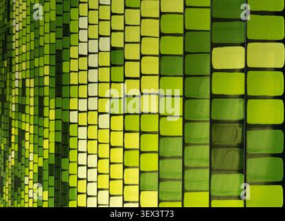 Abstract green geometric pattern featuring repeating square shapes creating a modern background for design, architecture, technology, and creative con Stock Photo