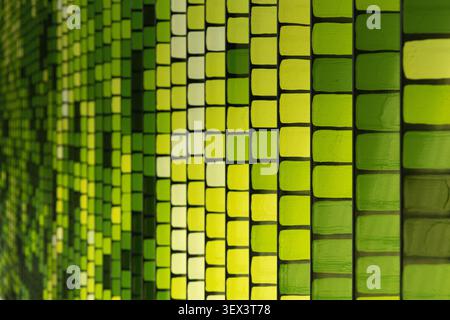 Abstract green geometric pattern with repeating square shapes creating a modern textured background for technology, design, architecture, and creative Stock Photo