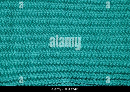 Teal wool knitting pattern showing textured fabric background Stock Photo