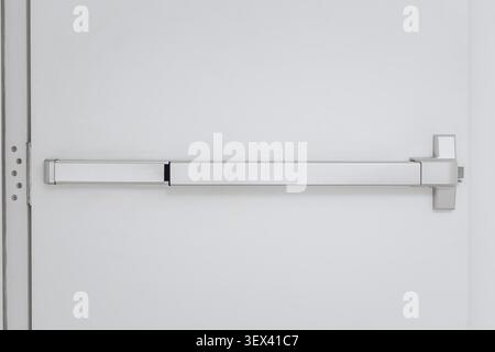 Emergency Door Push Bar, Exit Door Bar Push to Open Hardware, Door Equipment Closeup Stock Photo
