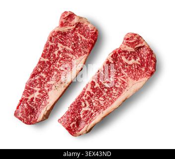 Two fresh raw premium Wagyu beef steak slices isolated on a white background, top view. High-quality marbled beef cuts with rich texture and exception Stock Photo