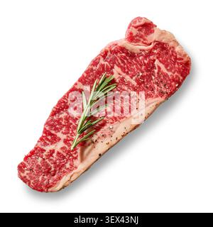 Fresh raw premium Wagyu beef steak slice with rosemary isolated on a white background, top view. High-quality marbled beef cut garnished with aromatic Stock Photo