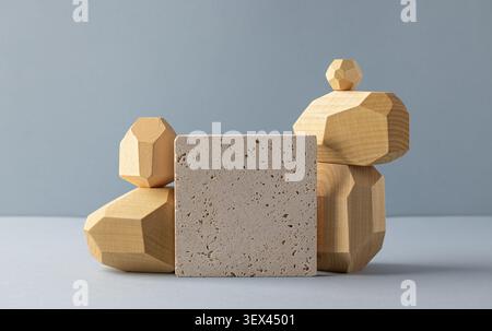 Geometric Wooden Shapes with Textured Stone Block on Minimalist Grey Background for Artistic Concept Displays Stock Photo