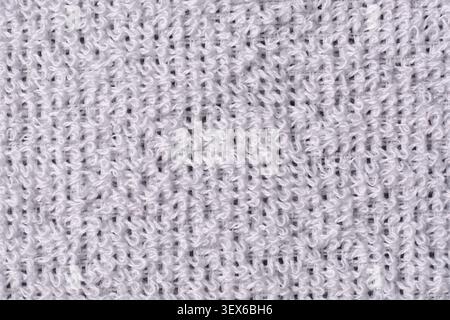 white terry cloth towel full frame texture close-up macro, soft cotton fabric loops textile manufacturing background Stock Photo