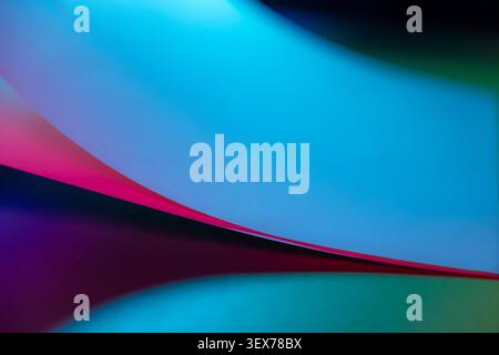 Abstract background showing flowing blue, pink, and purple color gradients with soft focus and smooth curves creating a modern and vibrant design Stock Photo