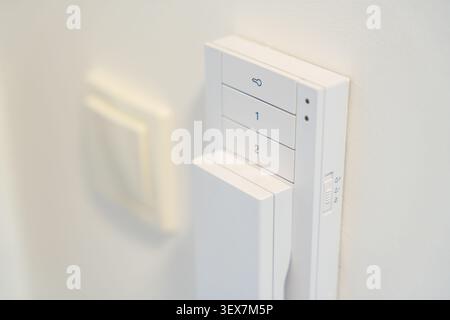 Close up of a home intercom control panel on a wall near an apartment entrance. Residential access control concept for security, communication and Stock Photo