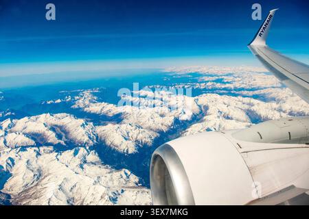 France, Ryanair plane above the clouds, view from the cabin, wing and engine Stock Photo