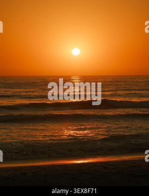 Sunset over the Pacific Ocean in Imperial Beach, California Stock Photo