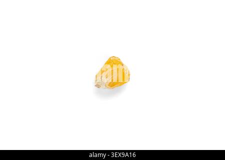 Single dry corn seed isolated on a pure white background. Top view of one yellow maize planting grain Stock Photo