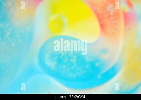 Soft blurred macro abstract with dreamy blue, yellow, and pink tones, smooth translucent shapes, airy background, copy space  Stock Photo