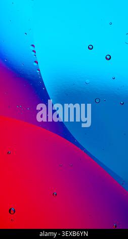 Oil and water creating an abstract background with colorful liquid and bubbles Stock Photo