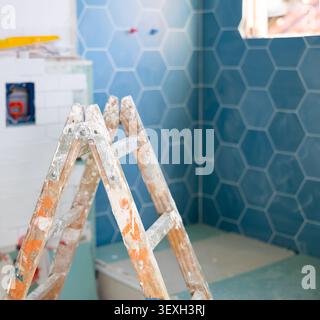 Stepladder in empty bathroom during improvement works Stock Photo