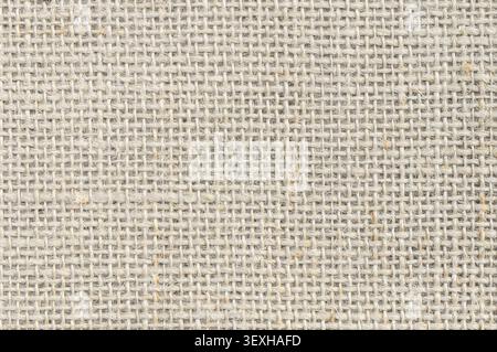 Close up view of woven jute fabric in a light natural color, showing intricate threads and rugged textiles Stock Photo