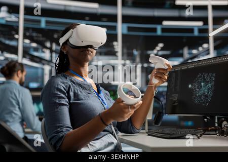 Data center engineer uses a VR headset in a data center to manage AI systems, train neural networks, and configure hardware. Stock Photo