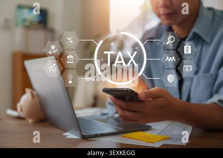 Man using smartphone for online tax filing and mobile financial management Stock Photo