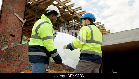 People, engineer and reading at site with blueprint, document and planning for architecture. Men, meeting or team outdoor with paperwork, inspection Stock Photo