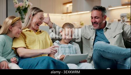 Game, smile or family on couch with tablet, happy moment or help with online activity. Support, parents or children in house with tech, playing Stock Photo