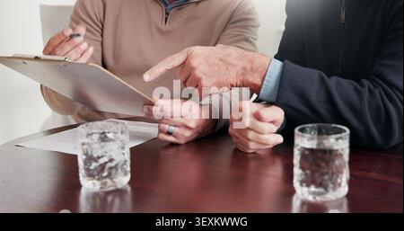 Hands, person and advisor at house with clipboard, finance report and form for loan application. People, consultant and reading document for budget Stock Photo