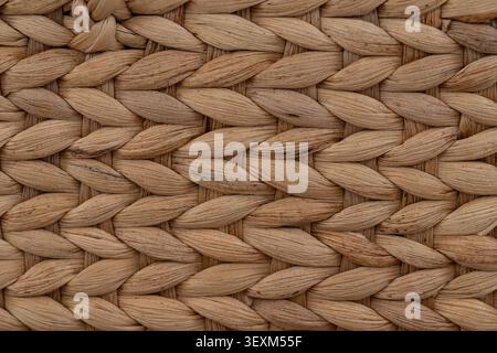 Close up macro texture of handwoven water hyacinth weave in natural earth tone background Stock Photo