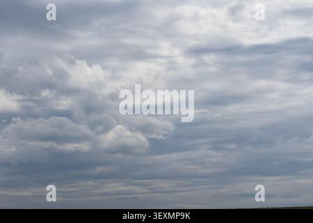 Textured overcast sky with dramatic storm clouds before rainfall creating a natural weather background Stock Photo