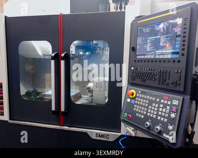 Ukraine, Kyiv - May 26, 2026:High-precision SMEC CNC lathe machine featuring an automated control system and digital interface for metalworking in a m Stock Photo