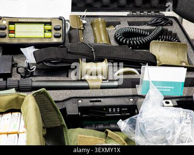 A professional-grade universal dosimeter-radiometer measurement kit neatly organized with sensors, probes, and accessories inside a rugged protective Stock Photo