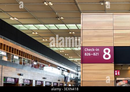 Berlin, Germany - 24 Jul, 2022. Check in area Berlin Brandenburg Airport BER show counter zone marker modern terminal interior. Airport wayfinding Stock Photo