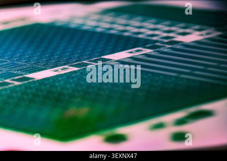 Silicon wafer displaying microchip patterns, symbolizing technology and design Stock Photo