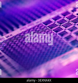 Wafer showing microelectronic chip patterns, representing semiconductor technology and computing Stock Photo