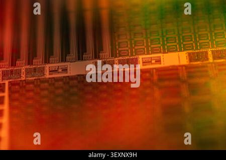 Wafer showing complex patterns of microchips on a semiconductor surface Stock Photo