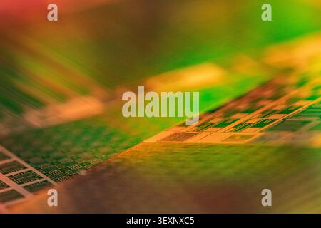 Silicon wafer reflecting light and displaying microchip patterns Stock Photo