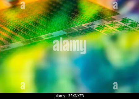 Silicon wafer reflecting multicolored light with microchip patterns Stock Photo