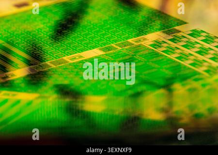 Electronic wafer showcasing abstract patterns and intricate microchip components Stock Photo