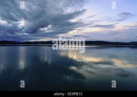 Cloud formation over Lac d'Aiguebelette, Large Natural Lake, at the foot of the Epine Mountains, Aiguebelette-le-Lac, Savoie Department, France Stock Photo