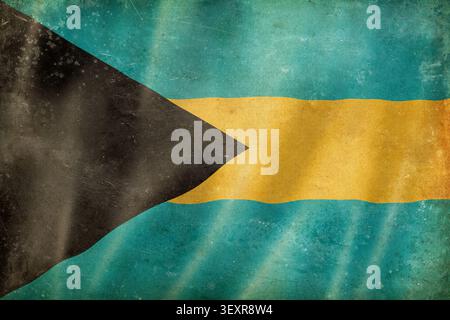 Old waving Bahamian flag, worn, stained, and crumpled. Textured canva background Stock Photo