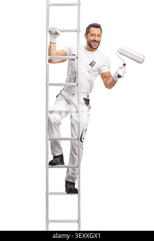Painter in white overalls climbing a ladder and holding a paint roller isolated on white background Stock Photo