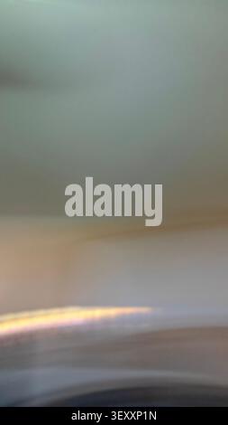 Blurred light streak creating an abstract, minimalist background with a gradient effect Stock Photo