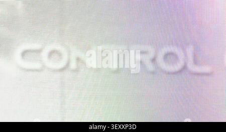 Control text displays on a glowing, pixelated digital screen background Stock Photo