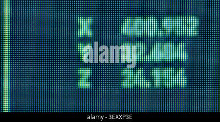 Pixels on old CRT screen creating blue and green digital text Stock Photo