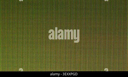 Microscopic view of glowing LCD pixel grid forming a modern technology background Stock Photo