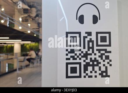 Interactive Digital Experience Featuring QR Code Linked to Music and Audio Content Exploration Stock Photo
