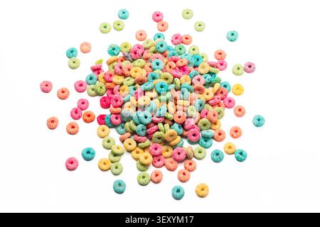 Pile of colorful fruit loops cereal isolated on white background Stock Photo