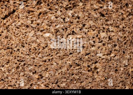 Texture of dark rye whole grain bread crumb close up Stock Photo