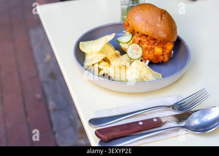 Cheeseburger and Chips Restaurant Presentation Close-Up Stock Photo