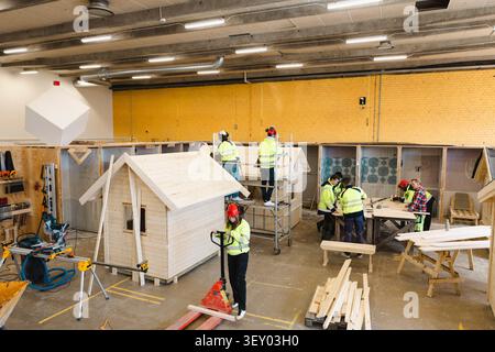 High angle view of vocational students doing carpentry tasks in workshop at upper secondary school Stock Photo